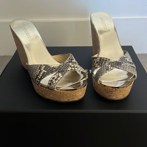 Jimmy Choo cork wedges with leather animal print.  Size 38 in good condition.